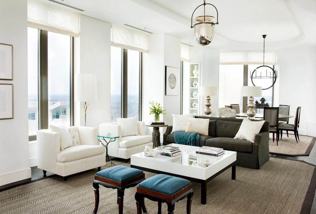 A suite sitting room with a sofa and armchairs